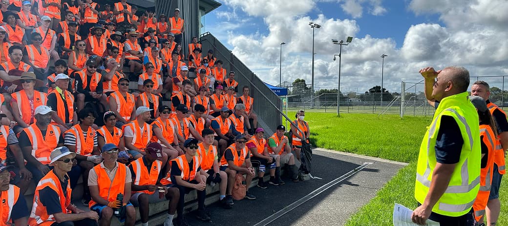 SVA volunteers in orange vests